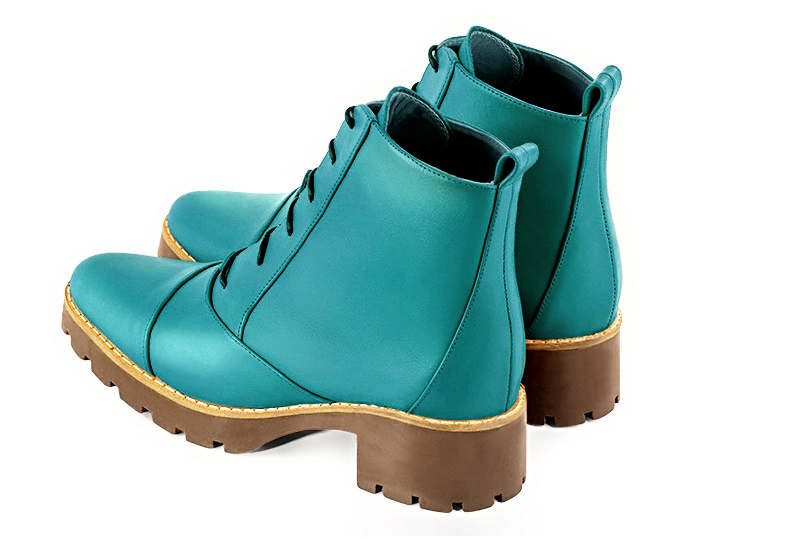 Turquoise blue women's ankle boots with laces at the front. Round toe. Low rubber soles. Rear view - Florence KOOIJMAN